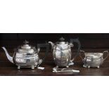 A matched silver three piece tea service, comprising teapot, hot water pot,