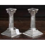 A pair of Victorian silver dwarf candlesticks, Corinthian columns with reeded column bases,