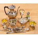 A collection of silver plate, including coffee pot, flatware, milk jugs,