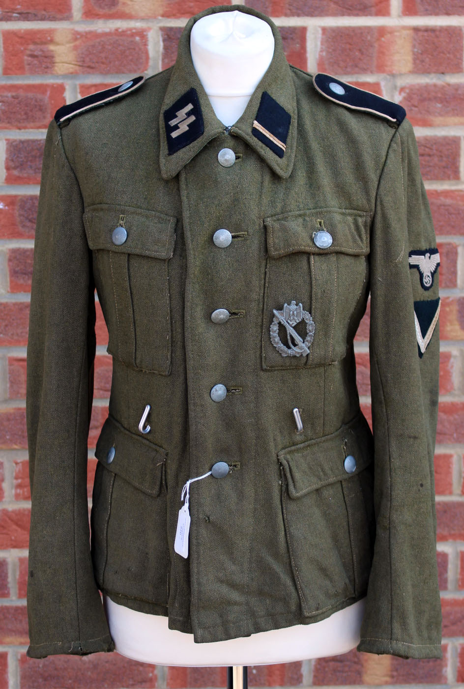 Third Reich Waffen SS Infantrymans M43 pattern tunic. A rare example of a Waffen SS tunic.