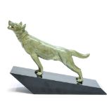 Laurens, an Art Deco verdigris figure of a wolf, on angled marble base,