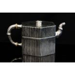 An Aesthetic Movement silver teapot, hexagonal section, each side with strapped dowel fence design,