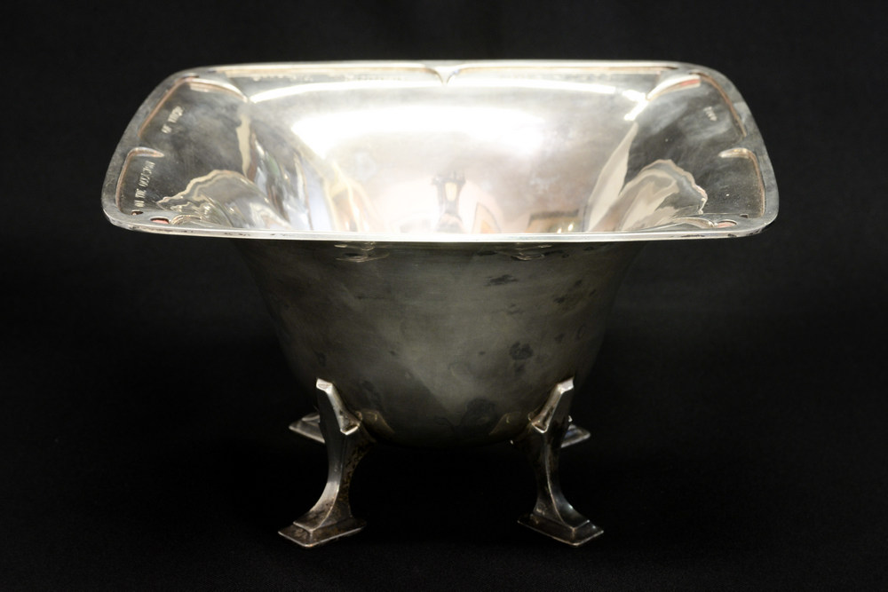 An Art Deco silver bowl, flared conical form with everted rim, supported on square section,