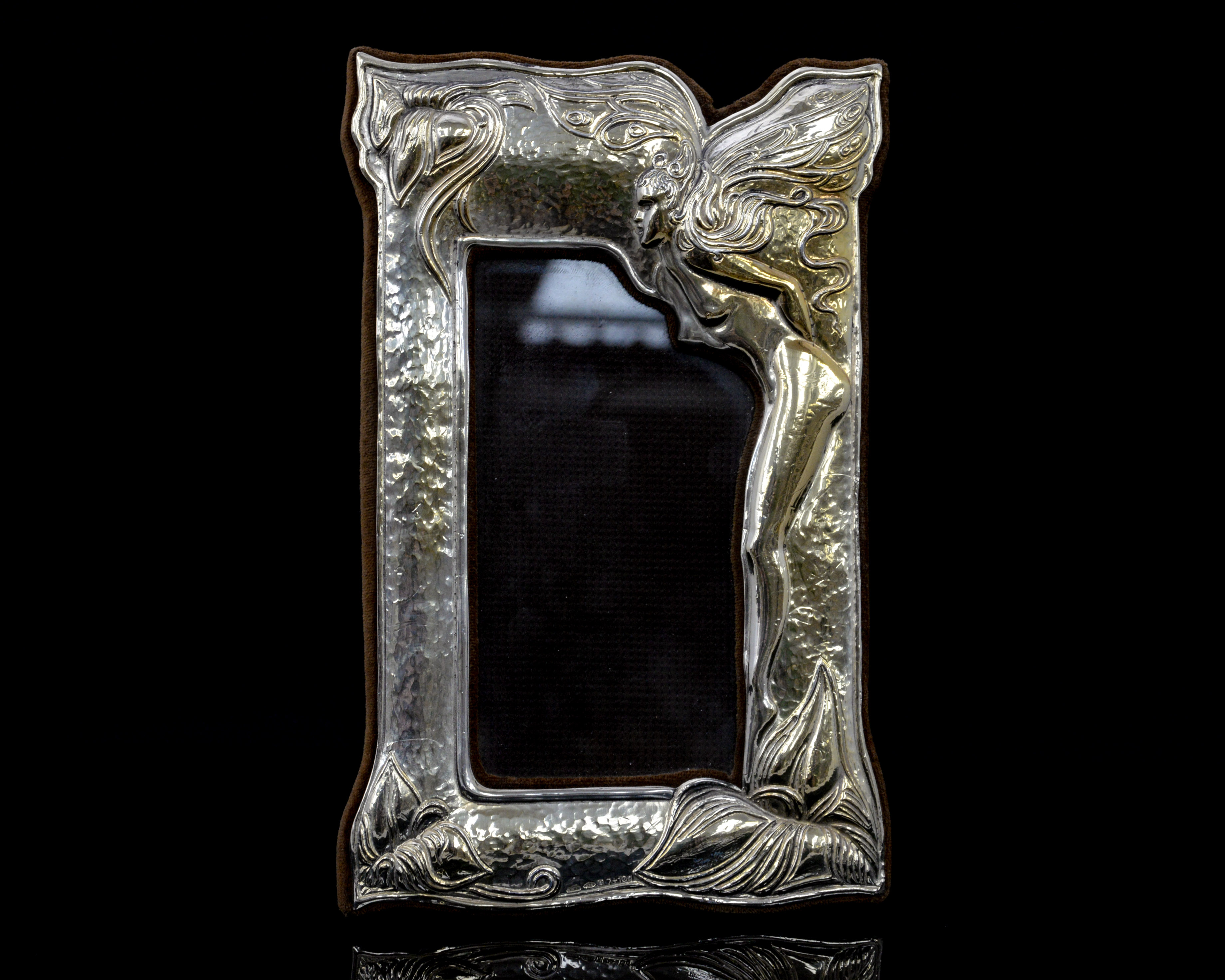 An Art Nouveau style contemporary silver photo frame,