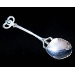 An Arts and Crafts silver and enamel preserve spoon,