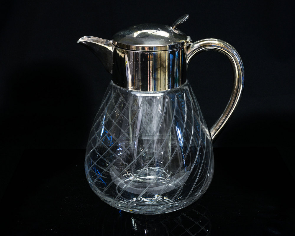 A 1950s glass water jug, the bulbous body with acid etched wrythen stripe design,