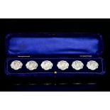 A cased set of six Edwardian, Art Nouveau silver buttons,