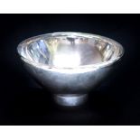 Georg Jensen, a Danish silver bowl, hammered finish with inverted rim, on a cylindrical foot,