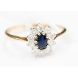 A sapphire and diamond oval cluster 9ct gold ring, centre oval blue sapphire, 6 mm x 4 mm,