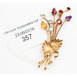 A 9 ct gold spray brooch with topaz garnet amethyst flowers and citrine