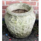 A pair of composite planters with intertwined carved decoration