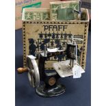 A boxed Pfaff child's sewing machine