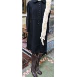 One black wool 1960s coat with a Peter Pan collar,