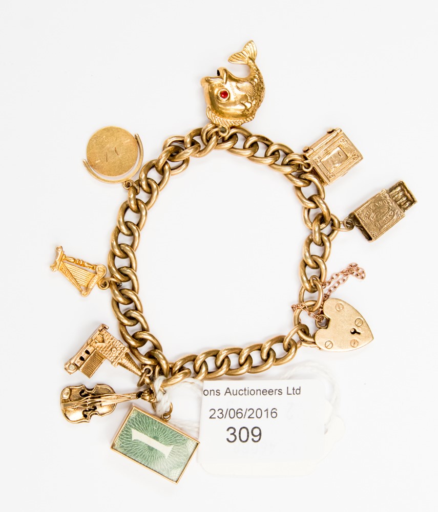 A 9 ct gold padlock charm bracelet with six various charms and two other 9 ct gold charms, approx.