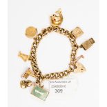 A 9 ct gold padlock charm bracelet with six various charms and two other 9 ct gold charms, approx.