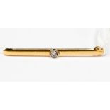 An 18 ct gold diamond set bar brooch 2.9 grms approx.