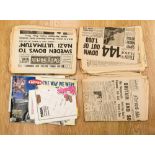 A collection of various World War II newspapers,