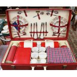 A 1950s Brexton Luxury Picnic set, model 6626, containing ceramic plates, cutlery, flasks,