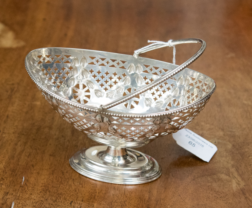 A George V silver pierced oval basket with swing handle, London 1907,