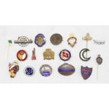 A collection of badges GWR British legion, a silver and enamel South Wales Borderers badge,