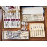 A collection of various cutlery, comprising knives,