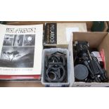 A collection of vintage cameras, photography books and filters including Olympus 35 RC,
