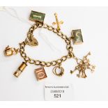 A 9 ct gold charm bracelet containing eight assorted charms and a padlock fastener, gross weight 34.