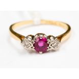 An 18 ct gold ruby and diamond three stone ring, size K approx.