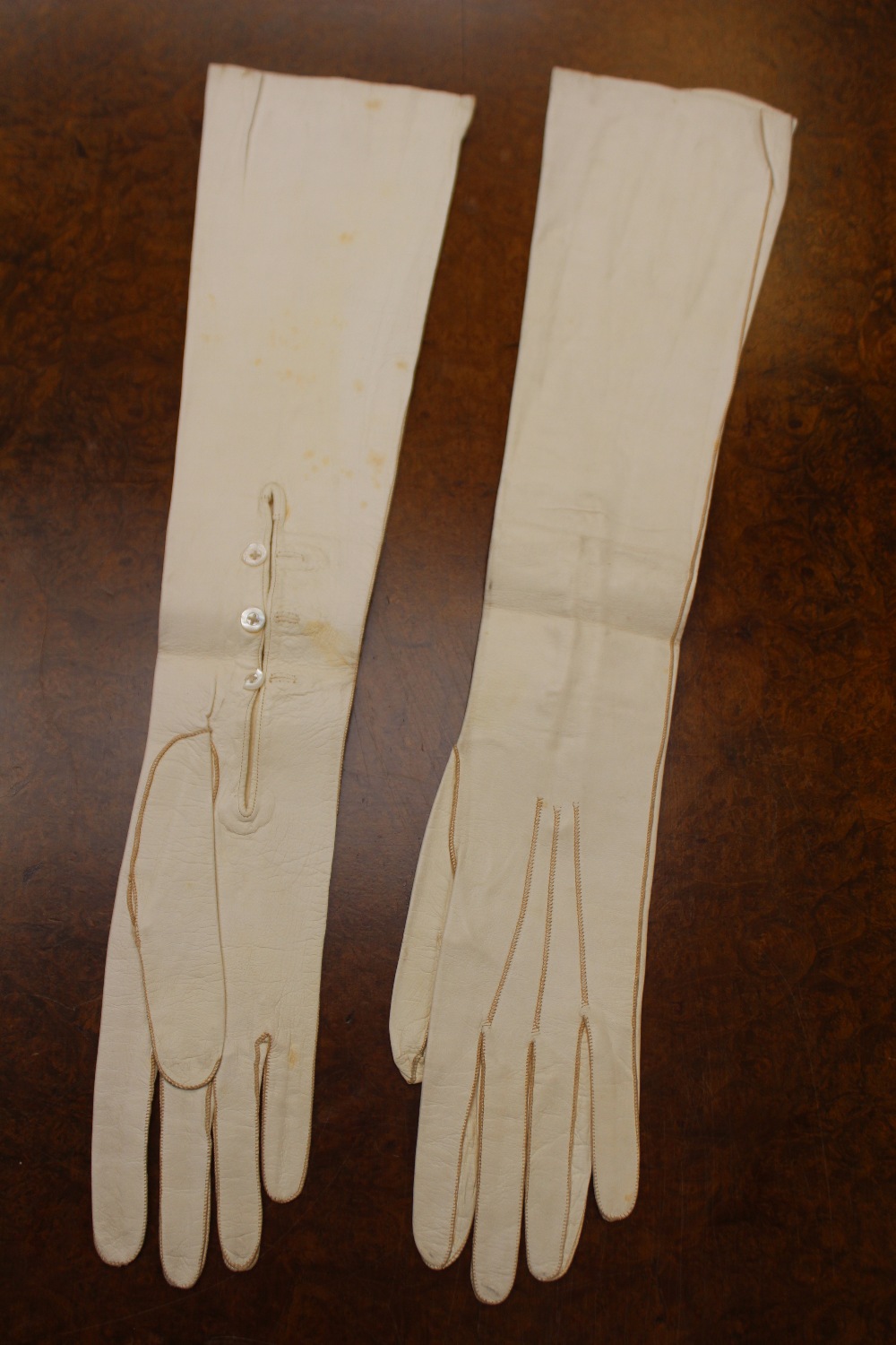 A pair of white kid long evening gloves