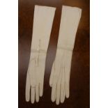 A pair of white kid long evening gloves