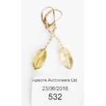 A pair of citrine quartz and yellow metal drop earrings