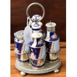 A EPNS four piece cruet stand with handle, four Continental ceramic bottles,