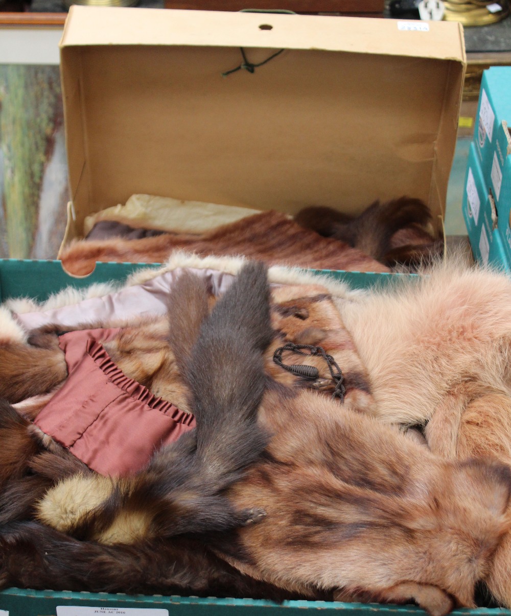 A brown fur stole with tippets in original box,