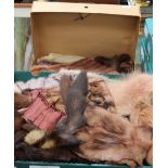 A brown fur stole with tippets in original box,