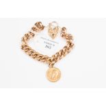 A 9 ct gold hollow link rose gold bracelet and suspended with a 1912 full sovereign,