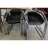 A set of six contemporary vinyl covered steel armchairs,