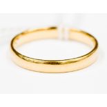 An 18 ct gold wedding band, size R, approx. weight 3.