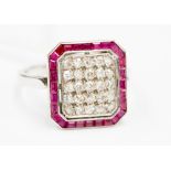 A diamond and ruby white metal cluster ring,