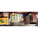 Four boxes of assorted books, comprising of football annuals, children's books, novels,