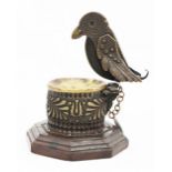 An Arts and Crafts cigar cutter in the form of a bird bath,