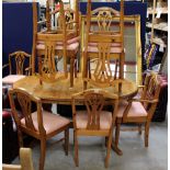 A double pedestal solid pine extending dining table and a set of eight chairs (9)