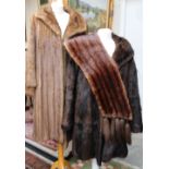 One full length mink coat, single breasted with hook and eye fastening,