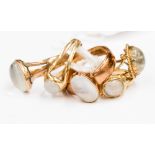 Five 9 ct gold rings set with moonstones, sizes Q, N, O 1/2, M 1/2 and M,