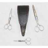 A boxed case of three pairs of ladies' scissors (steel with bright cut detail) by Thomas Hardy,