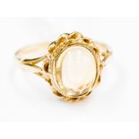 A 9 ct gold cabochon cut citrine, ring size P, 3.