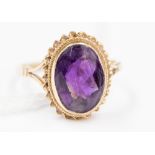 A 9 ct gold ring set with a large deep amethyst, approx.