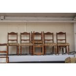 A late Victorian set of six mahogany dining chairs, with overstuffed seats,