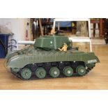 A plastic toy model of a tank,