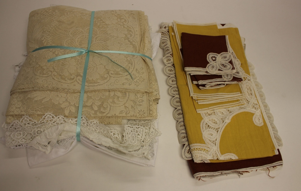 A collection of lace edged cloths and anti-macassars, circa 1930,