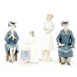 Two Lladro figures of boy and girl graduates,